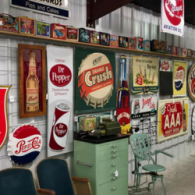 A wall filled with vintage soda advertising signs, metal bottle cap decor, and antique collectibles in a shop setting.