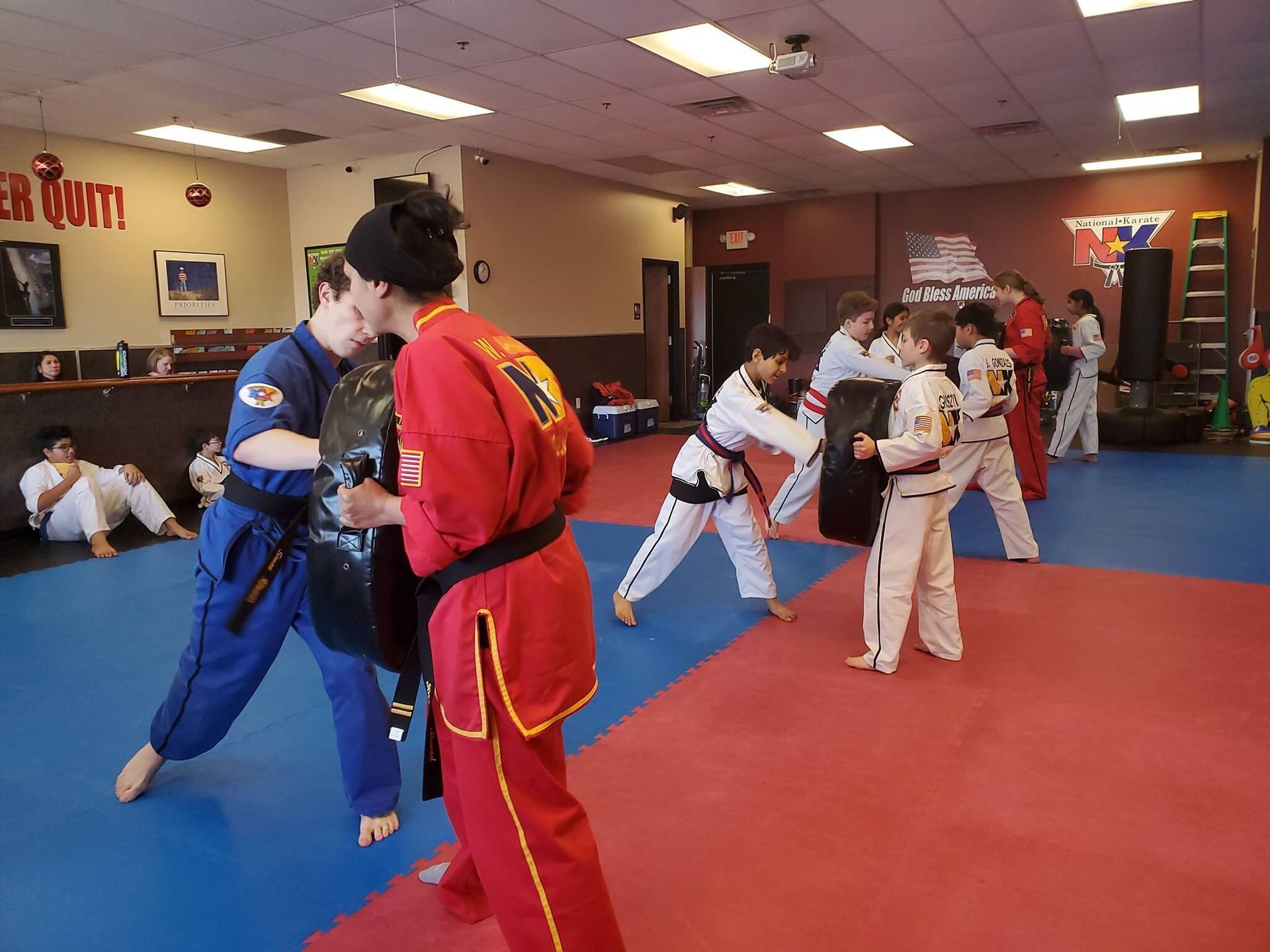 Kids practice partner drills at Wisconsin National Karate in New Berlin, WI, building confidence.