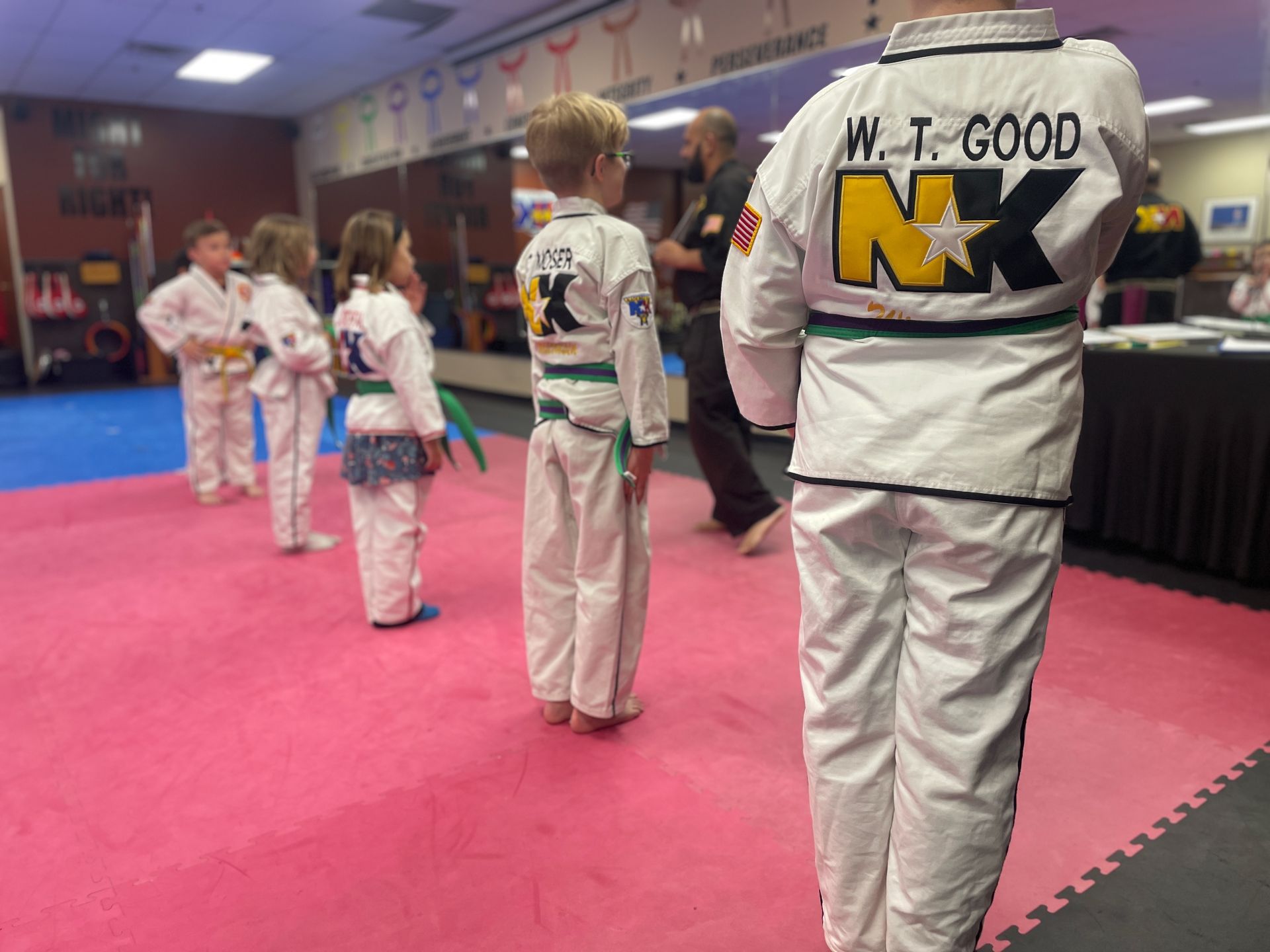 Kids practicing Karate drills at Wisconsin National Karate in New Berlin, WI, building focus.