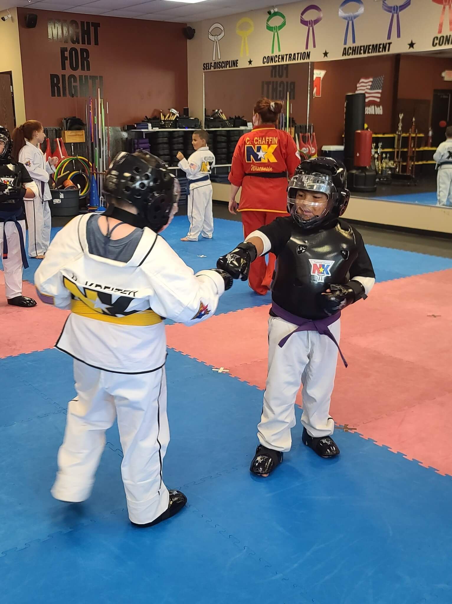 Kids and adults training Karate together at Wisconsin National Karate Kickboxing & Krav Maga.