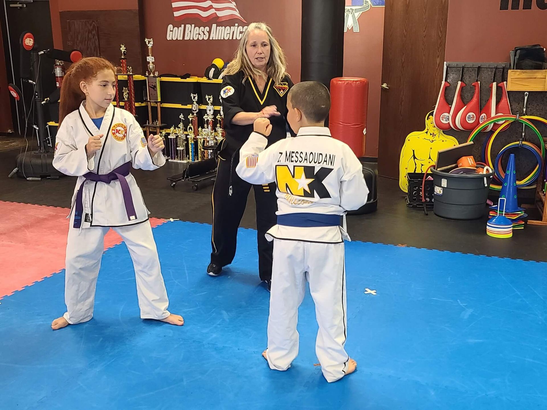 Students practicing Karate self-defense drills at Wisconsin National Karate Kickboxing & Krav Maga in New Berlin, WI for confidence.