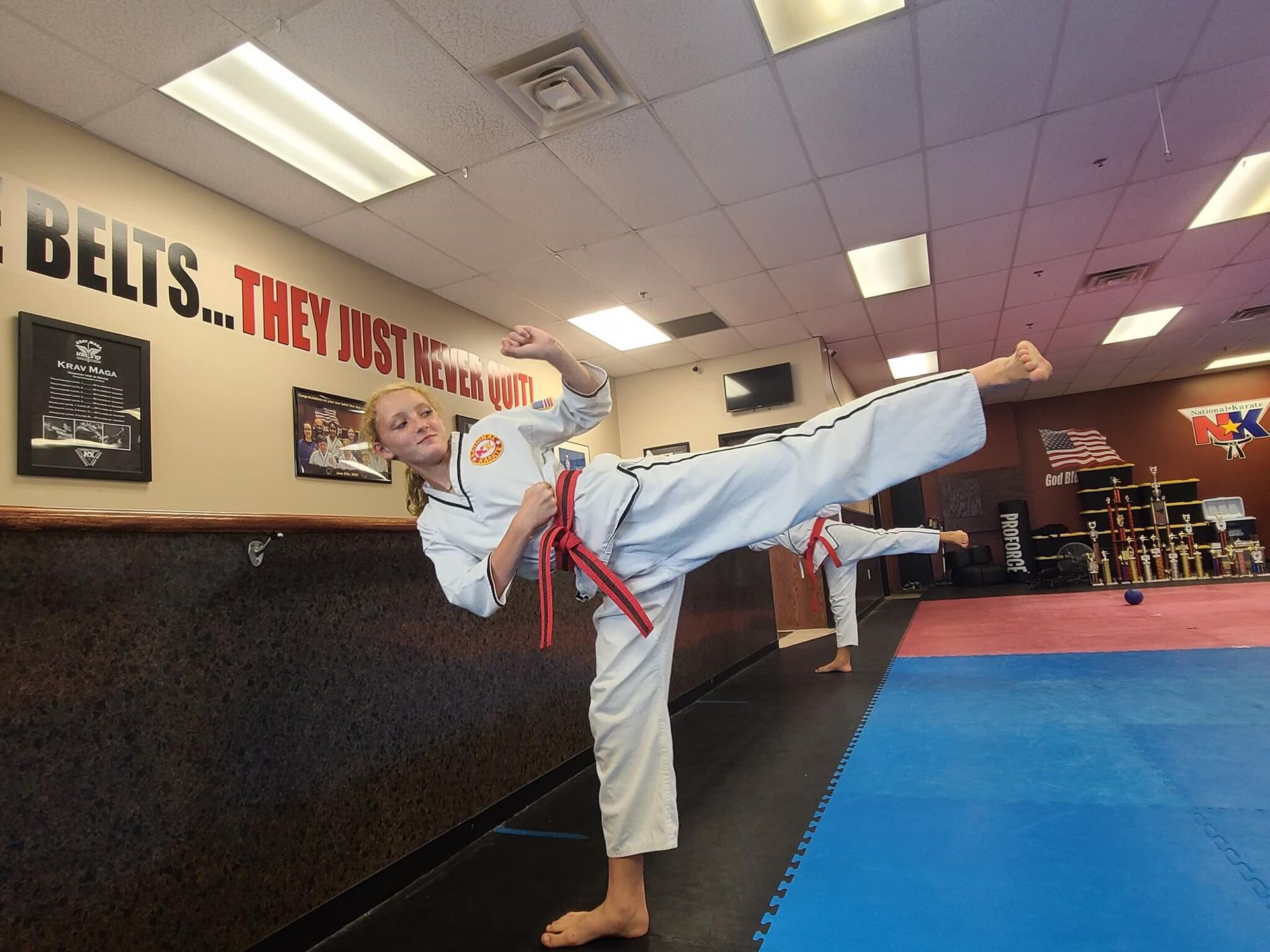 Students practicing basic Karate kicks at Wisconsin National Karate Kickboxing & Krav Maga in New Berlin, WI for safer self-defense.