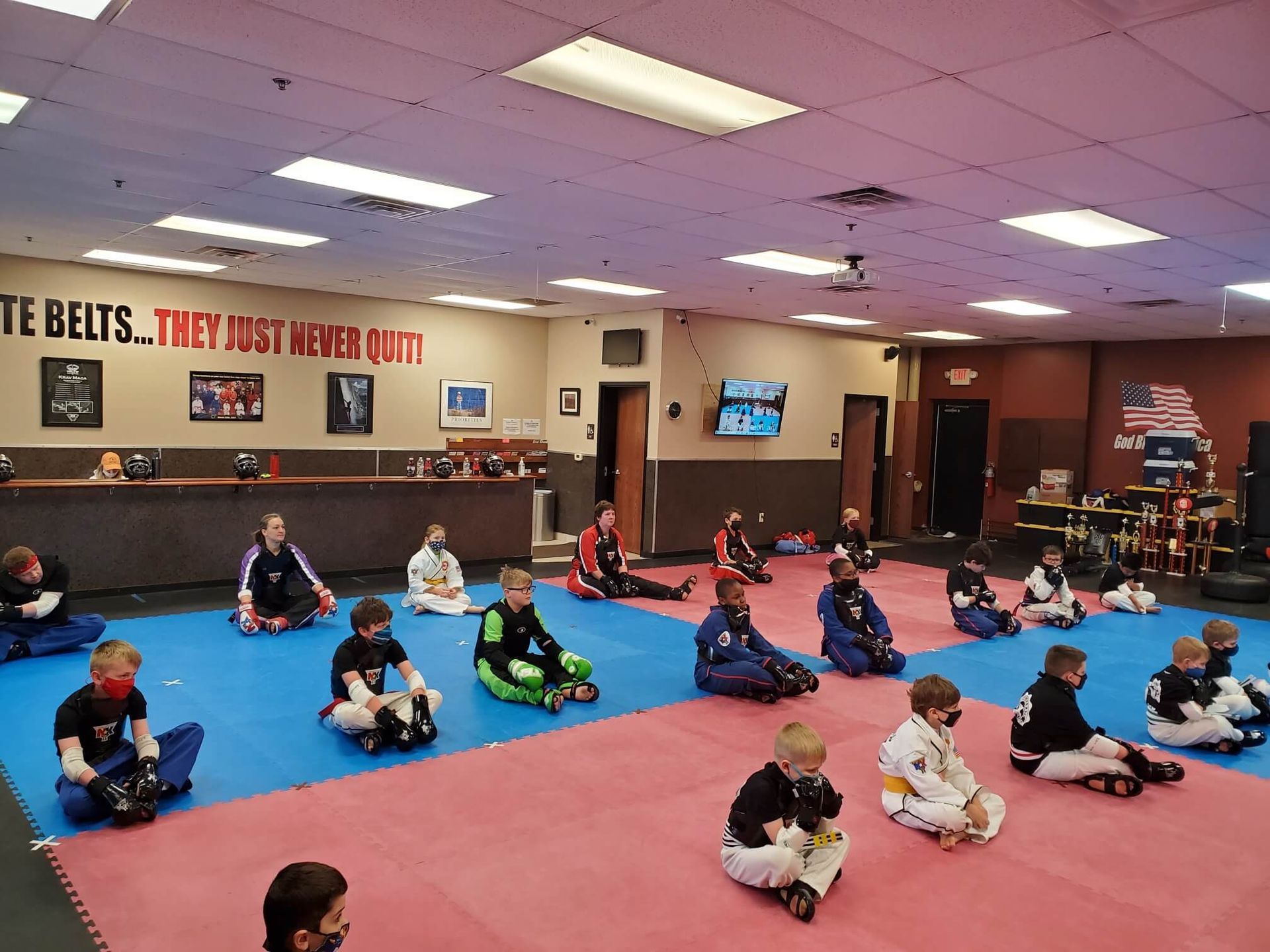 Adult students practicing Karate drills at Wisconsin National Karate Kickboxing & Krav Maga in New Berlin, WI for calm focus.