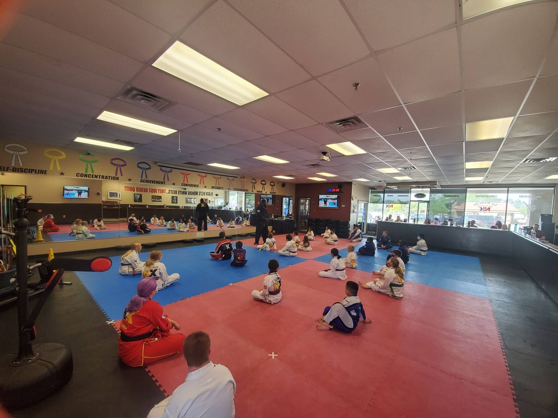 Kids practicing respectful partner drills at Wisconsin National Karate Kickboxing & Krav Maga in New Berlin, WI, building focus.
