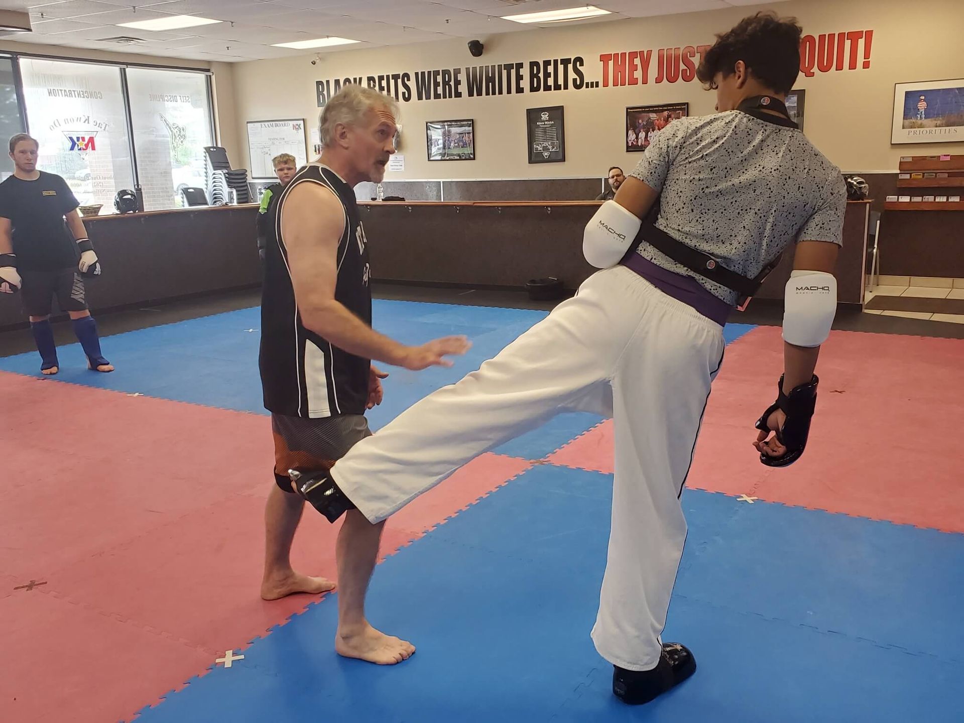Adults practicing partner drills at Wisconsin National Karate in New Berlin, WI.
