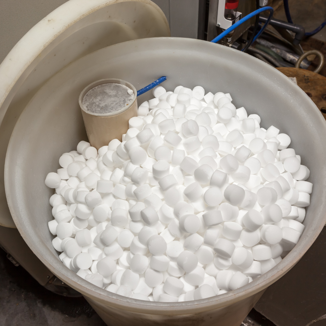 A plastic container filled with white foam cubes