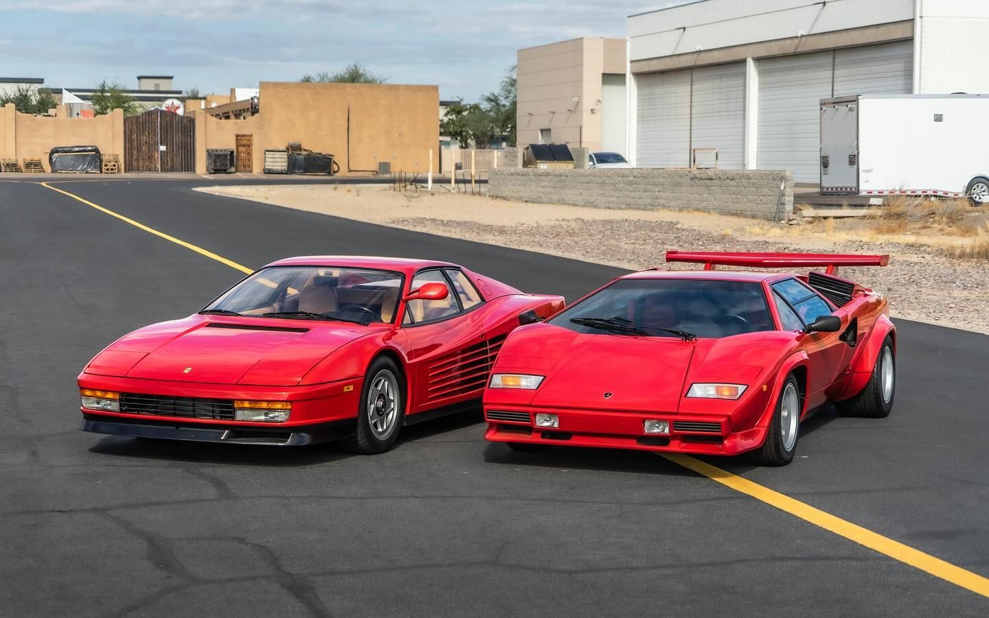 red cars with ceramic coating parked along the road