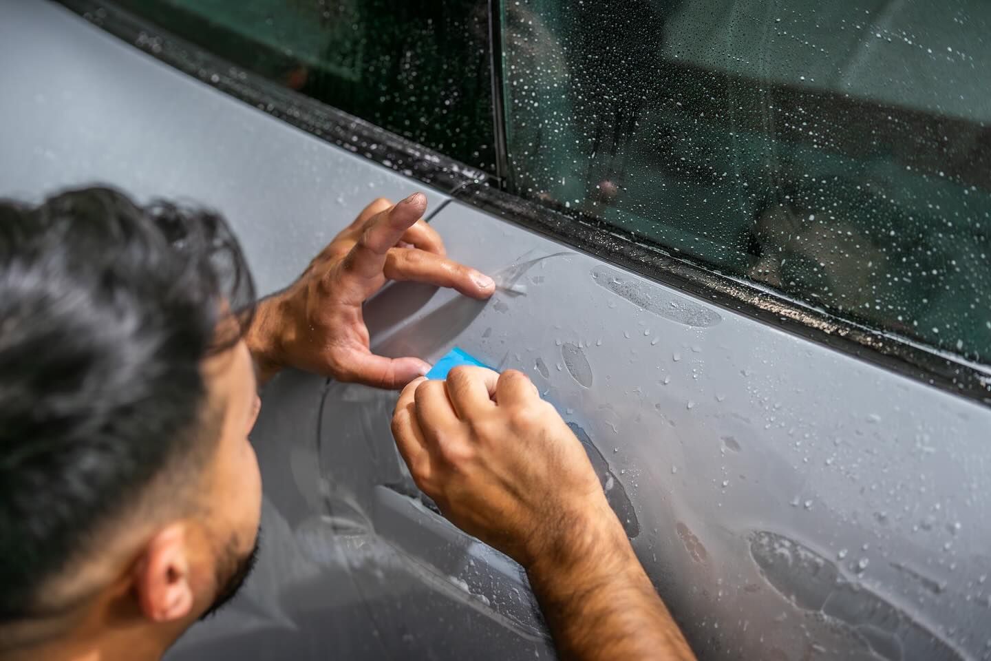 professional paint protection film installation on vehicle