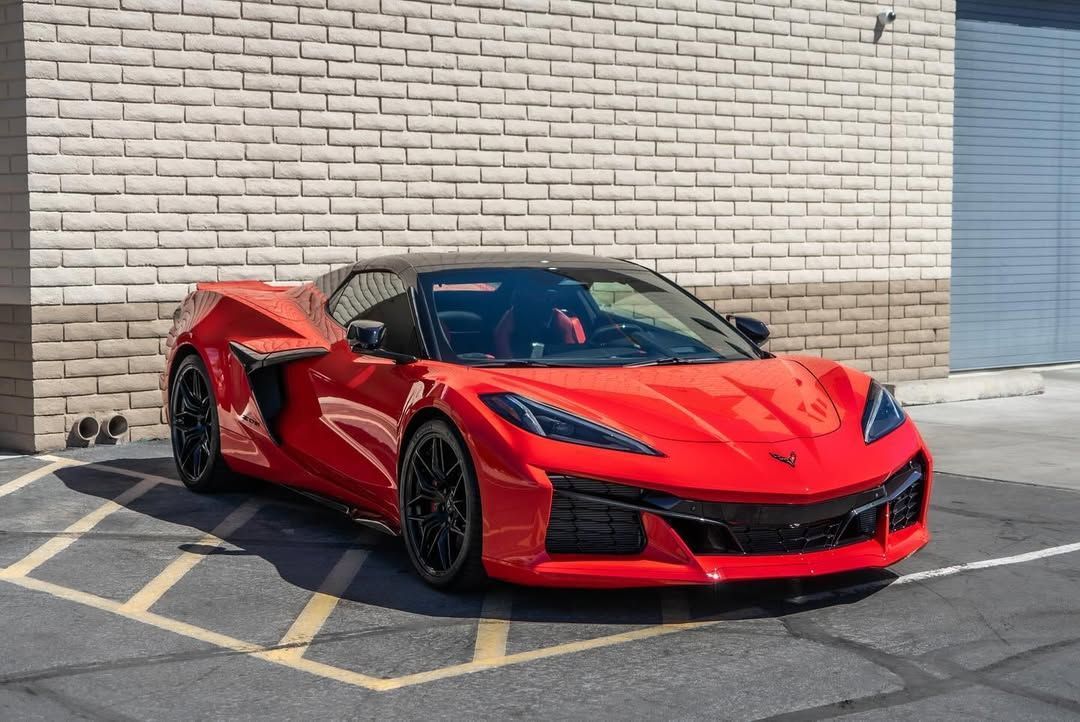 red vehicle with PPF parked outside the building