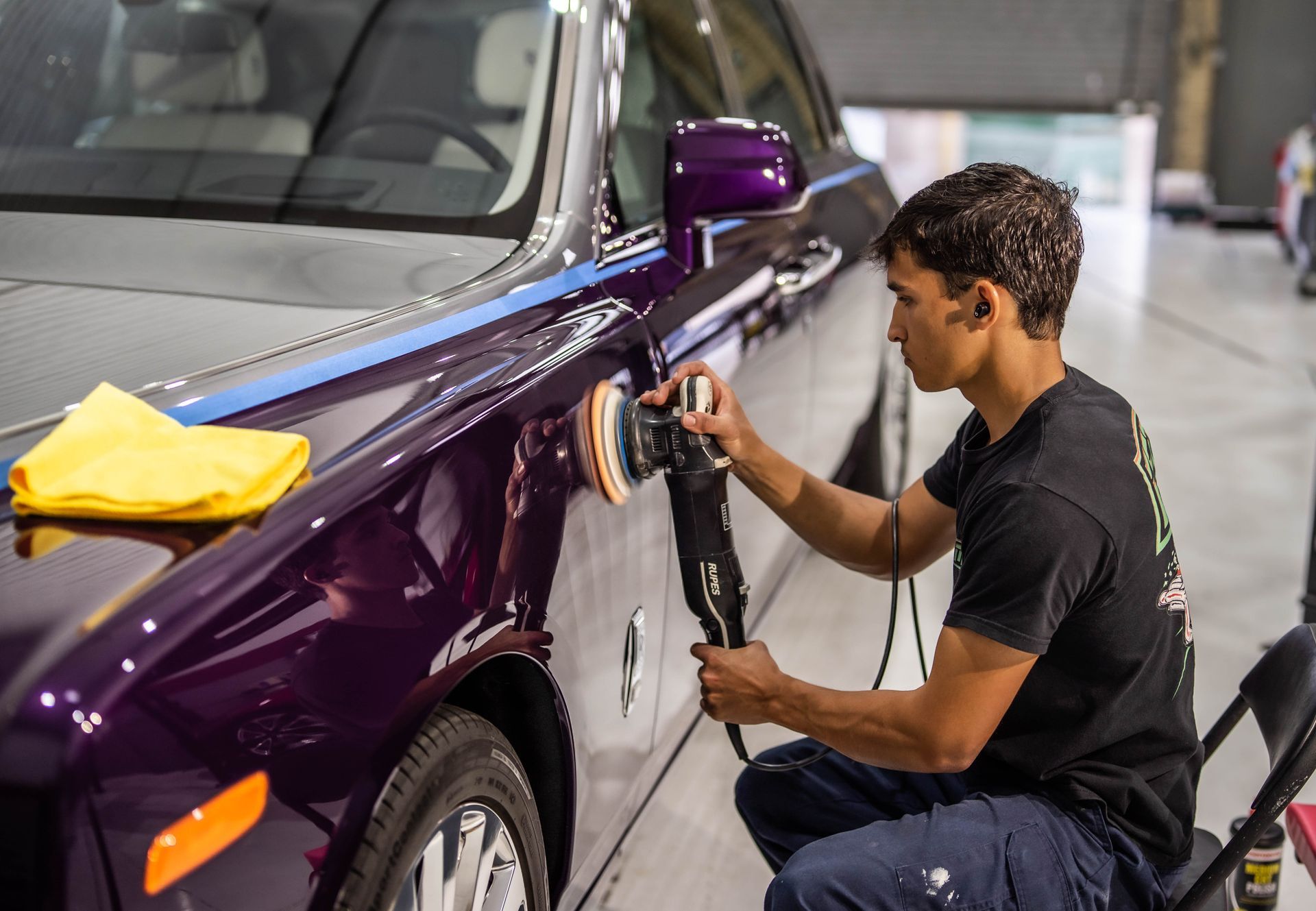 Crew member doing a ceramic coating