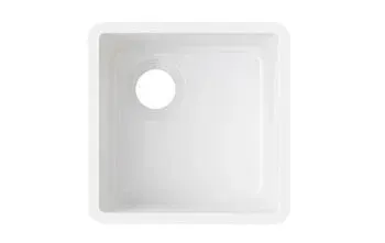 A white square sink with a hole in the middle on a white background.