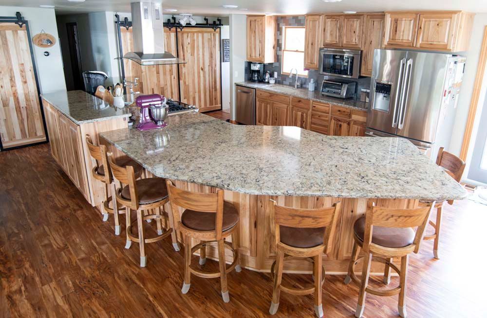There is a large island in the middle of the kitchen.