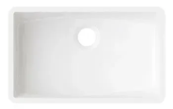 A white kitchen sink with a hole in the middle on a white background.