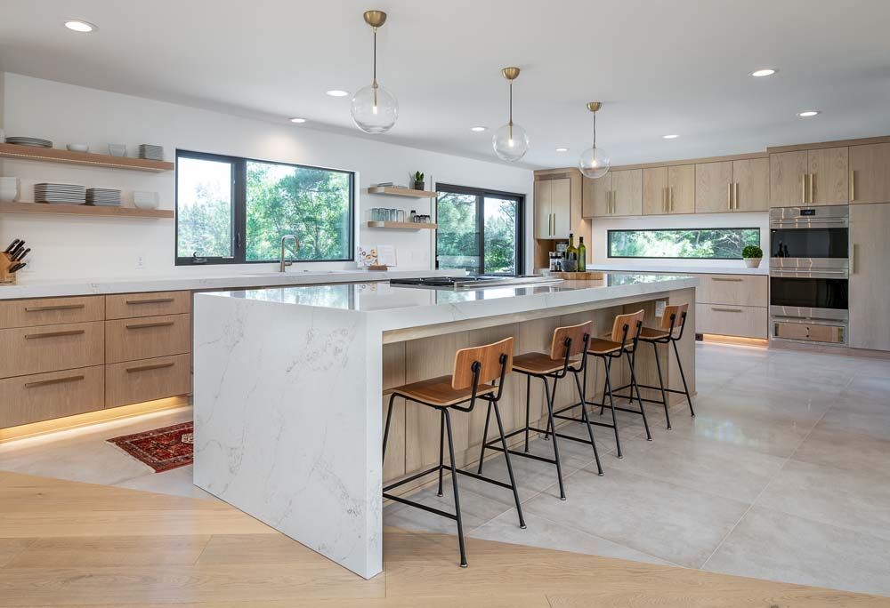 There is a large island in the middle of the kitchen.