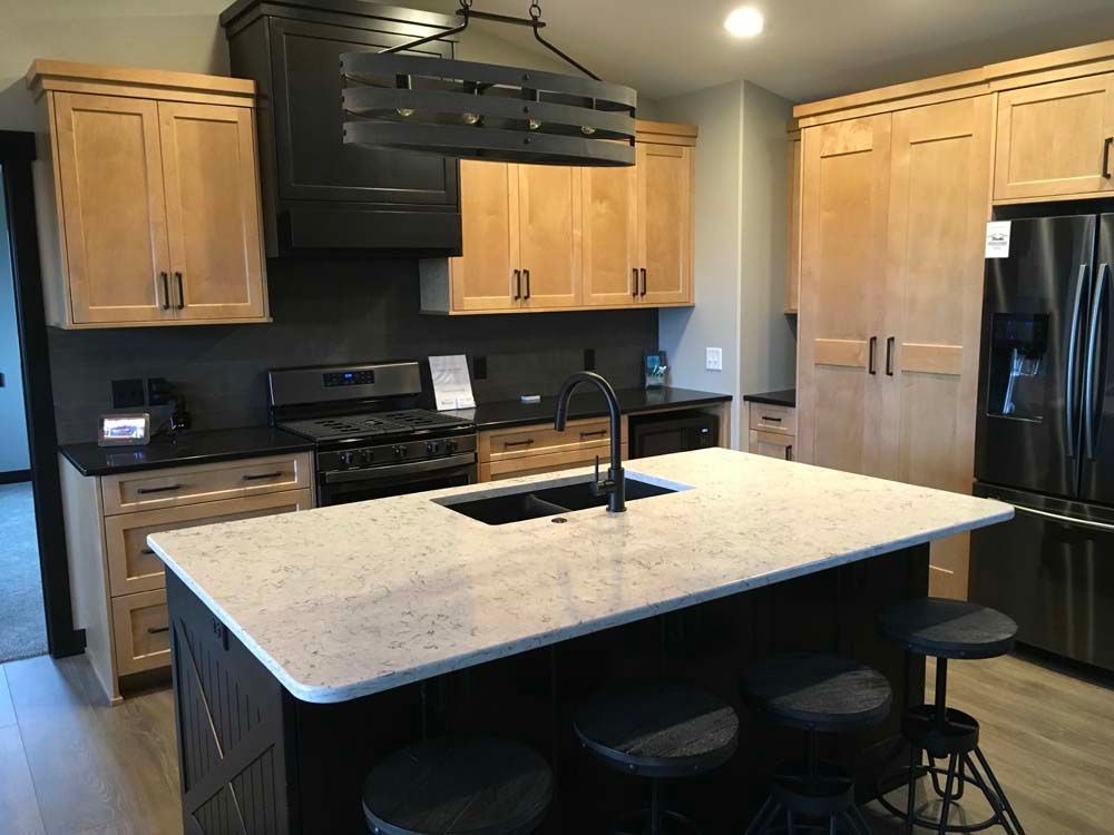 A kitchen with a large island in the middle of it.