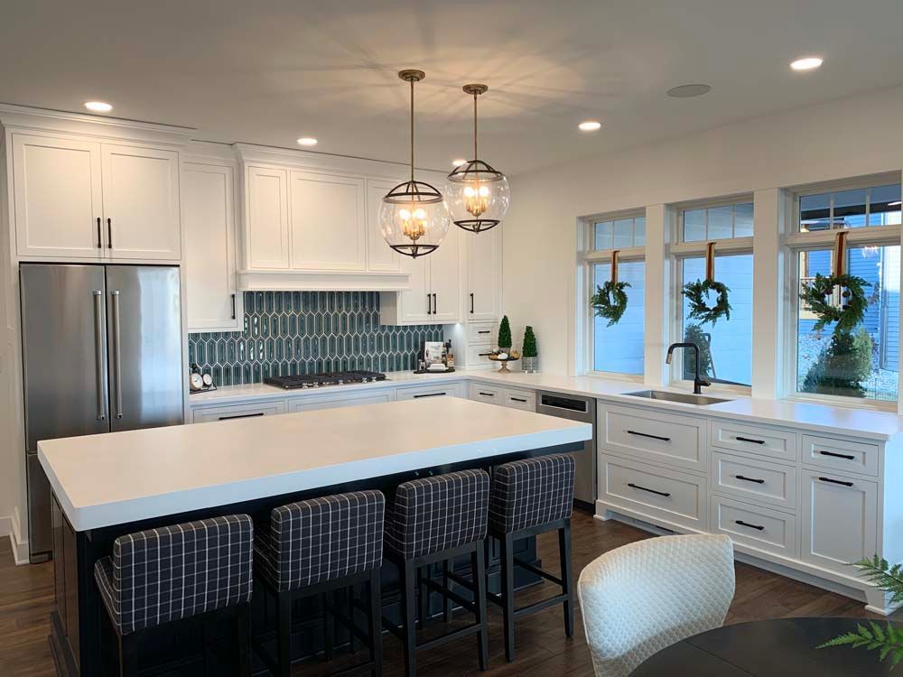 There is a large island in the middle of the kitchen.