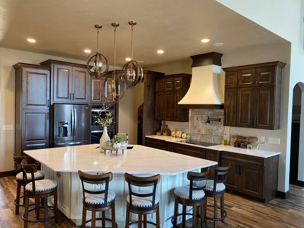 There is a large island in the middle of the kitchen.