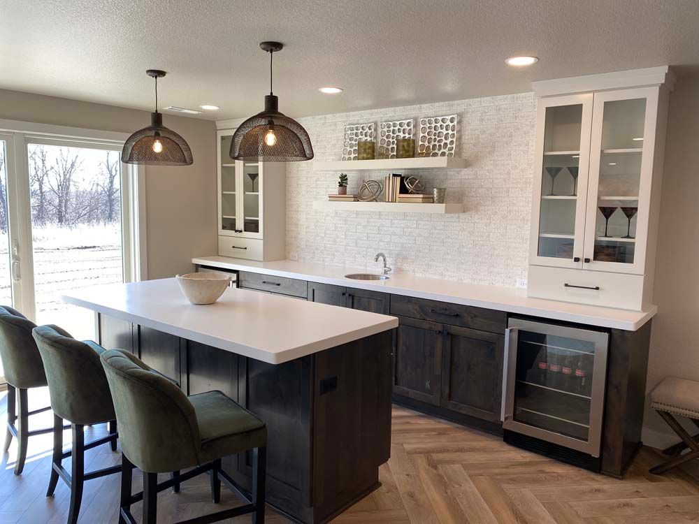 There is a large island in the middle of the kitchen.