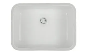 A white sink with a drain hole in the middle on a white background.