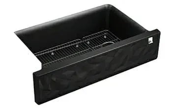 A black sink with a wire rack underneath it on a white background.