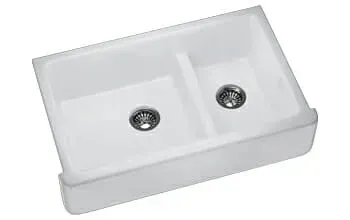 A white kitchen sink with two drains on a white background.