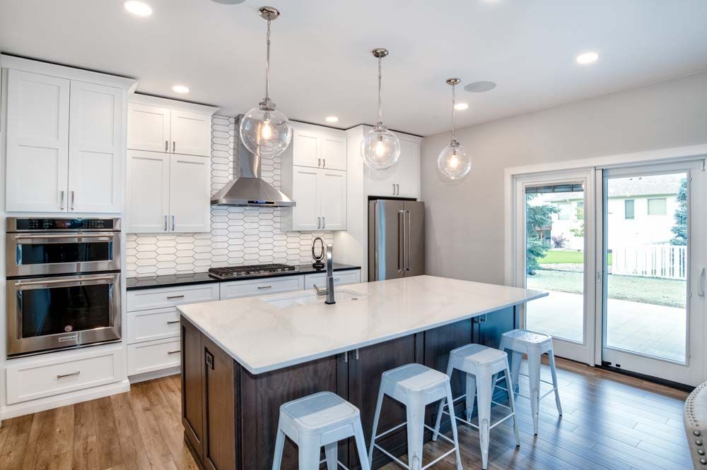 There is a large island in the middle of the kitchen.