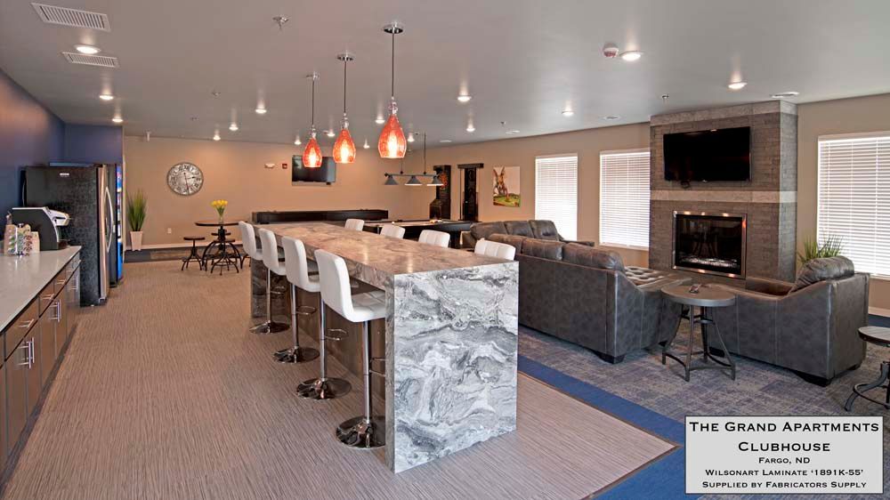 A large room with a lot of furniture and a fireplace.