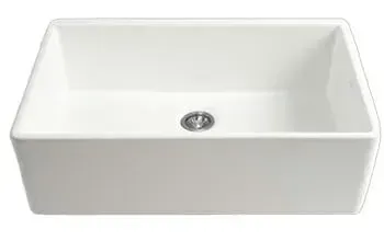 A white sink with a drain hole in the middle on a white background.