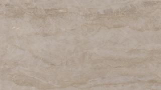 A close up of a beige tile with a marble texture.