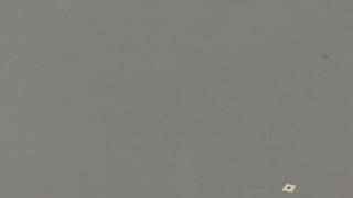 A close up of a gray surface with a white square on it.