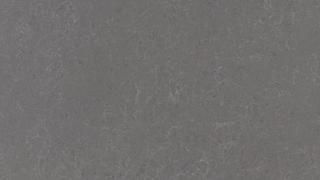 A close up of a gray paper texture.