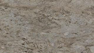 A close up of a gray granite counter top.