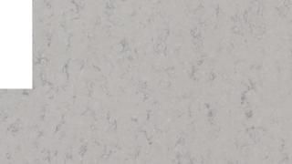 A close up of a white marble counter top with a white border.