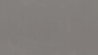 A close up of a gray background with a plain texture.