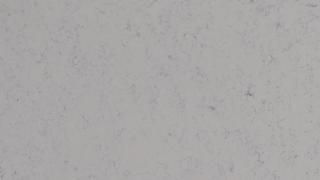 A close up of a white surface with a grainy texture.