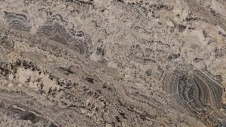 A close up of a granite counter top with a marble texture.
