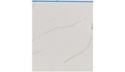 A white tile with a blue border is sitting on a white surface.