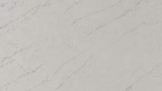 A close up of a white marble counter top.