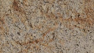 A close up of a granite counter top with a marble texture.