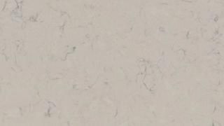 A close up of a white marble counter top.