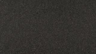 A close up of a black carpet texture.