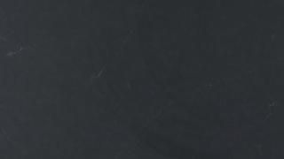 A close up of a blackboard with chalk on it.