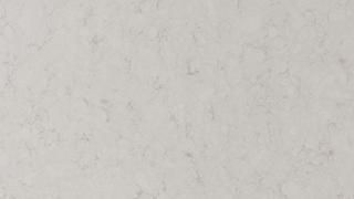 A close up of a white marble counter top.