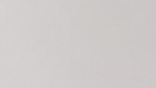 A close up of a white paper texture.