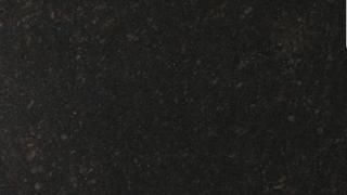 A close up of a black granite counter top.
