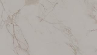 A close up of a white marble counter top.