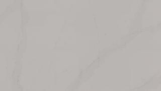 A close up of a white tile with a marble texture.