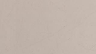 A close up of a white surface with a grainy texture.