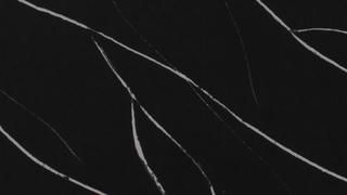 A close up of a black surface with white lines on it.