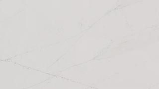 A close up of a white marble counter top.